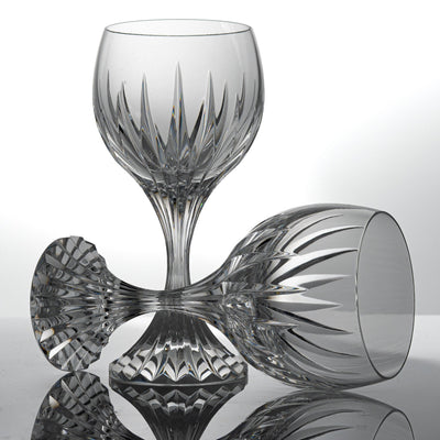Two Baccarat Massena wine glasses, one standing and one lying on its side