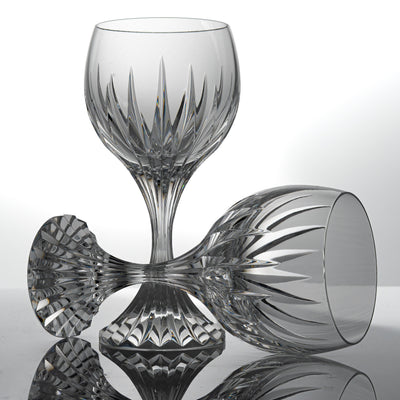 Two Baccarat Massena wine glasses, one standing and one lying on its side