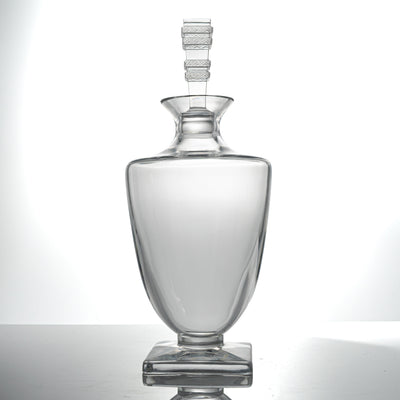 Lalique Argos crystal decanter with its tall stopper, standing upright on its square base