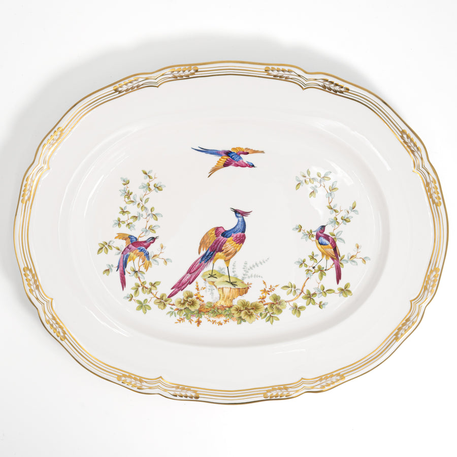 Spode Chelsea Bird oval serving platter from above, four colorful birds and a gold scalloped rim