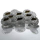 Ten Baccarat Bambous crystal place card holders seen from a low angle