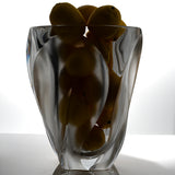 Lalique Ingrid vase filled with lemons, lit from behind