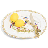 Spode Chelsea Bird oval platter styled with lemons and a gold coloured fork and knife