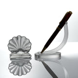 Baccarat Bambous crystal place card holder beside a pen on a stand for scale