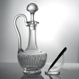 Baccarat Massena claret wine jug beside a pen on a stand for scale
